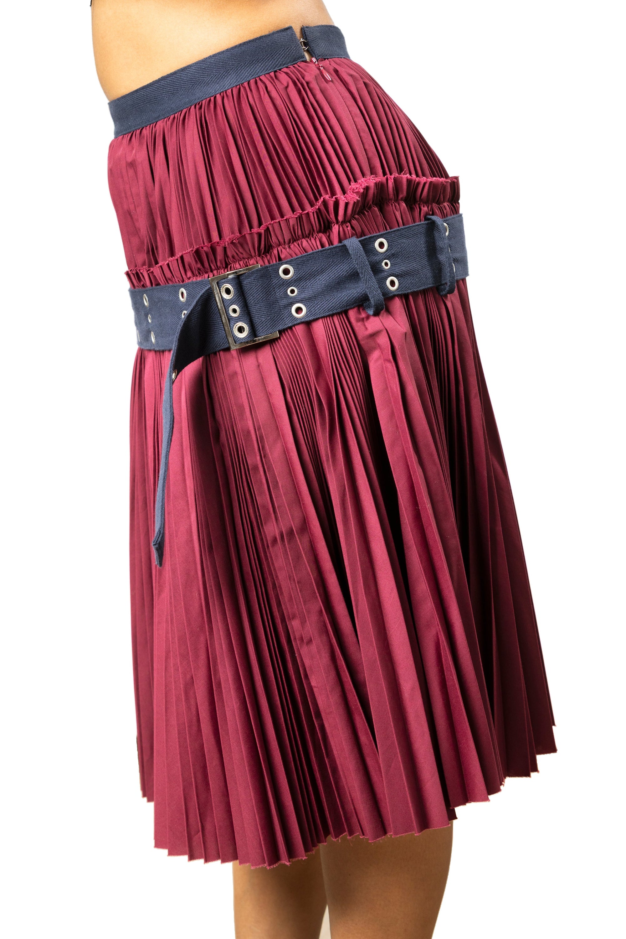 Side profile of sacai pleated belted skirt